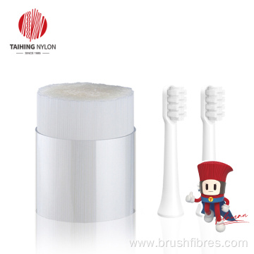 Soft PBT tapered filament for toothbrush